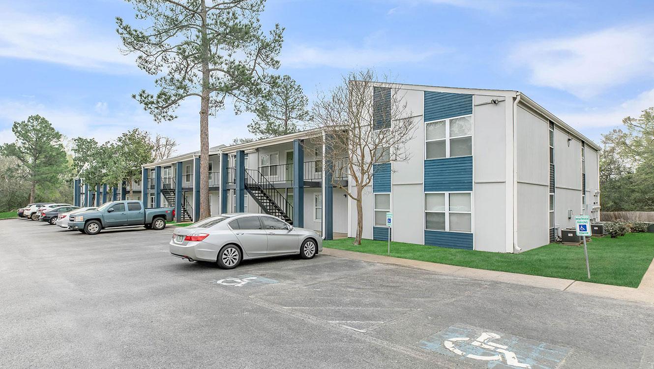 Gallery of Whispering Pines Apartments showcasing comfortable living spaces, community amenities, and scenic surroundings in Nacogdoches, Texas.
