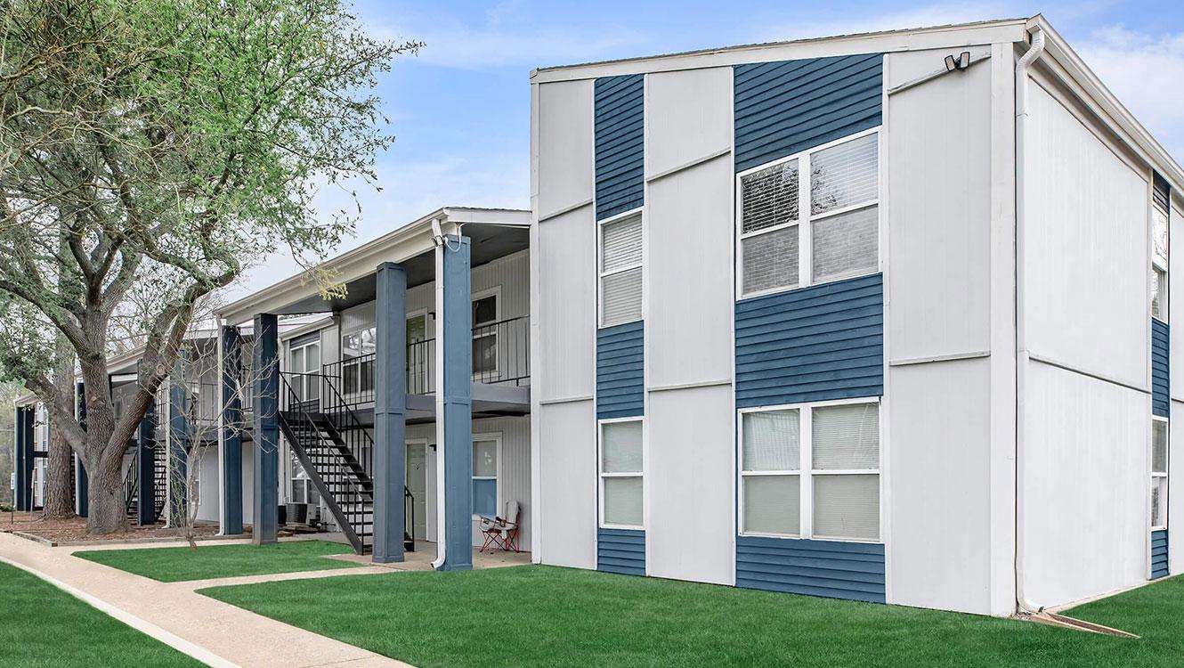 Gallery of Whispering Pines Apartments showcasing comfortable living spaces, community amenities, and scenic surroundings in Nacogdoches, Texas.